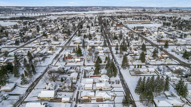 snowy aerial view with a residential view