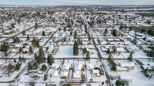 snowy aerial view featuring a residential view