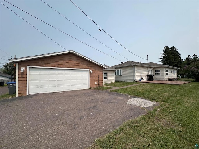2217 Susquehanna Ave, Superior, WI 54880 - ranch-style home featuring a front yard, a wooden deck, and a detached garage