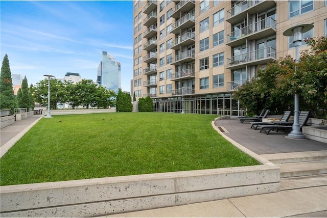 view of community featuring a lawn