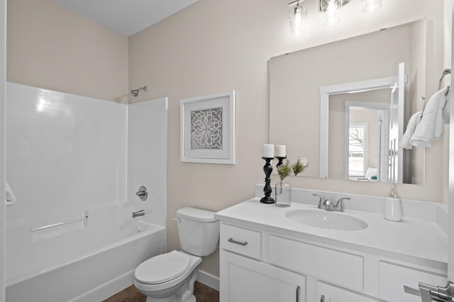 full bathroom with shower / tub combination, vanity, and toilet