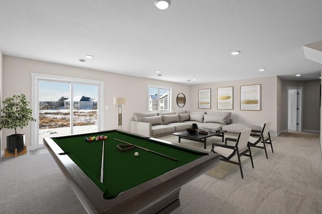 playroom with billiards, a healthy amount of sunlight, and light carpet