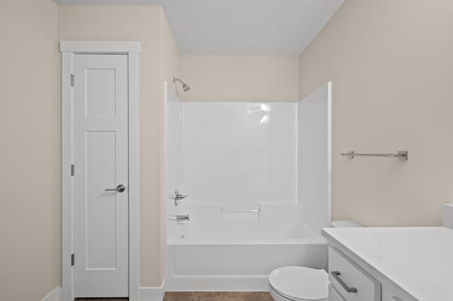 full bathroom with vanity, toilet, bathing tub / shower combination, and a textured ceiling