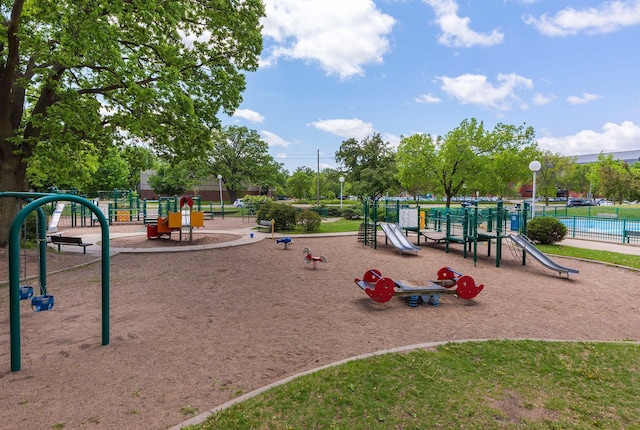 communal playground featuring fence