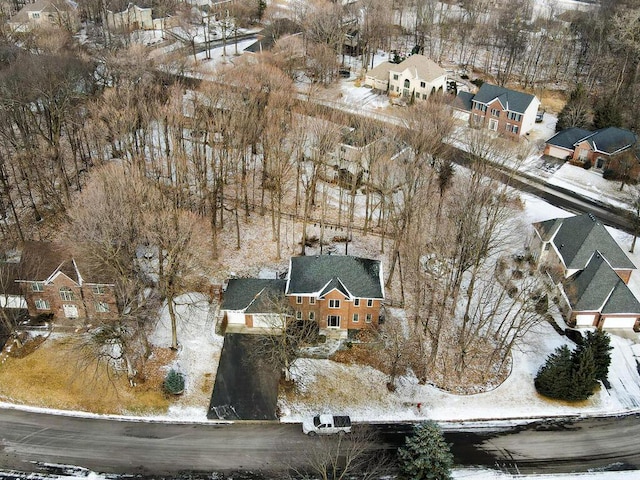 snowy aerial view featuring a residential view