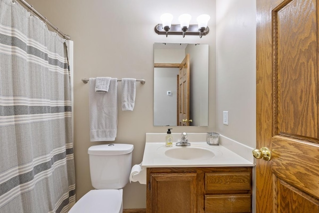 bathroom with toilet and vanity