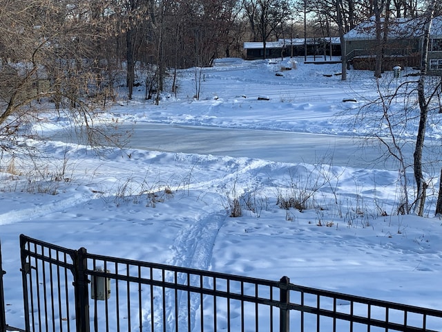 view of yard layered in snow