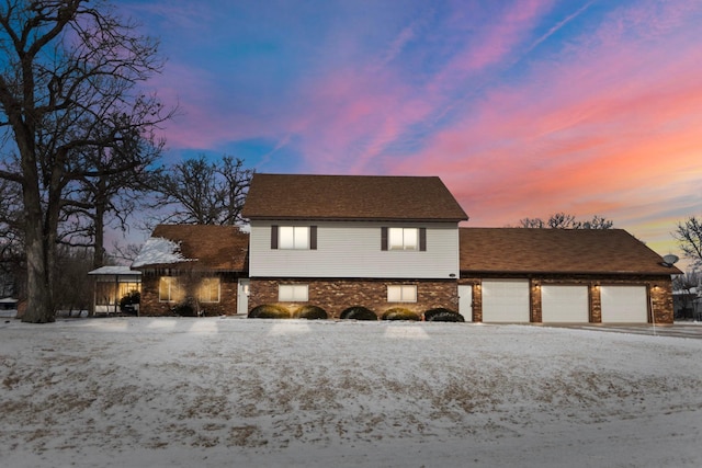 view of front of property with a garage