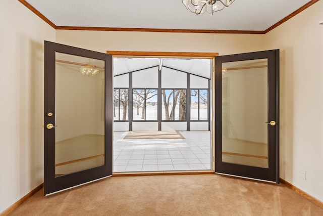 doorway with crown molding, lofted ceiling, carpet flooring, and a chandelier