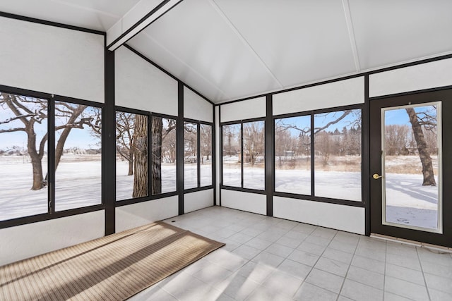 unfurnished sunroom featuring vaulted ceiling with beams