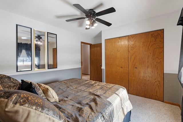 bedroom with carpet, ceiling fan, and a closet