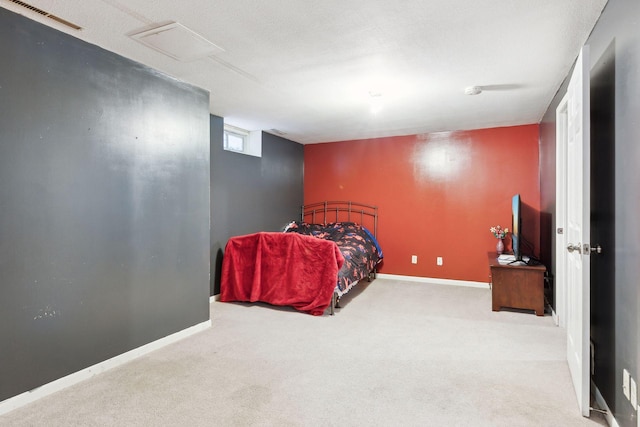 carpeted bedroom with a textured ceiling