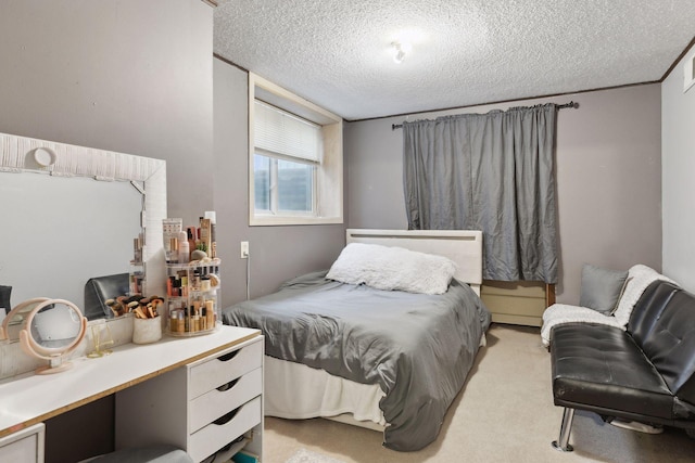 bedroom featuring light carpet and a textured ceiling