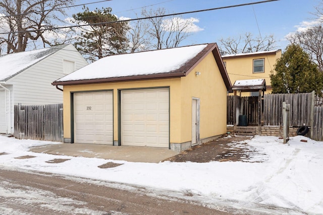 view of snow covered garage