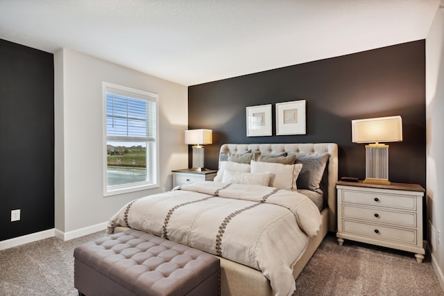 bedroom featuring dark colored carpet