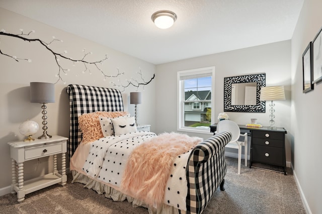 carpeted bedroom with a textured ceiling