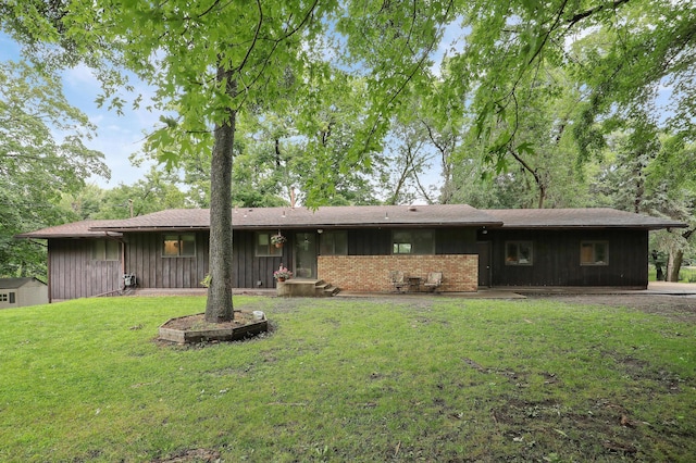 back of house with a yard