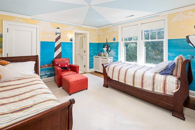 bedroom featuring ornamental molding and light carpet