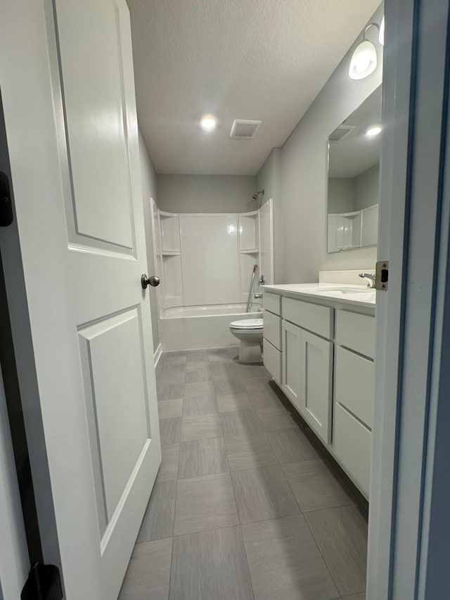 13647 Kaylemore Trl, Rosemount, MN 55068 - full bathroom featuring vanity, shower / bathtub combination, a textured ceiling, and tile patterned floors