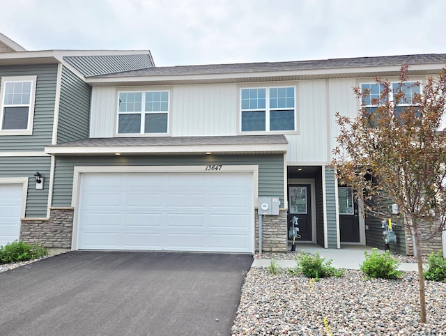 13647 Kaylemore Trl, Rosemount, MN 55068 - view of front of home with stone siding, driveway, and a garage