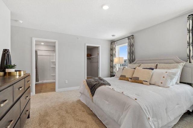 13647 Kaylemore Trl, Rosemount, MN 55068 - bedroom with light carpet, a walk in closet, a closet, ensuite bath, and recessed lighting