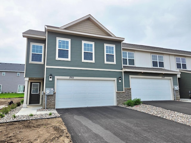 13651 Kaylemore Trl, Rosemount, MN 55068 - view of front of house with stone siding, asphalt driveway, and an attached garage