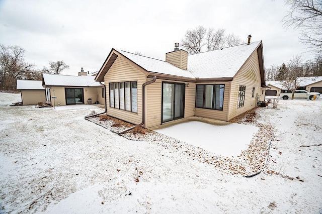 view of snow covered house