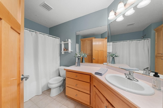 bathroom featuring tile patterned floors, toilet, a textured ceiling, vanity, and a notable chandelier