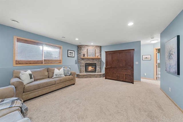 living room with a stone fireplace and light carpet