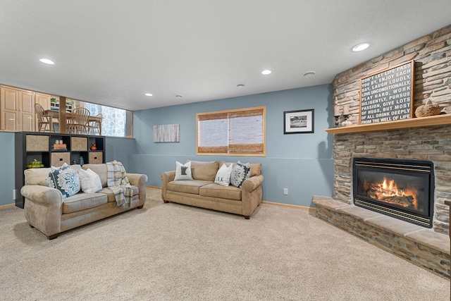 carpeted living room with a fireplace