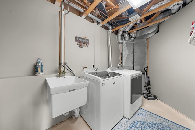 laundry room featuring sink and washing machine and dryer