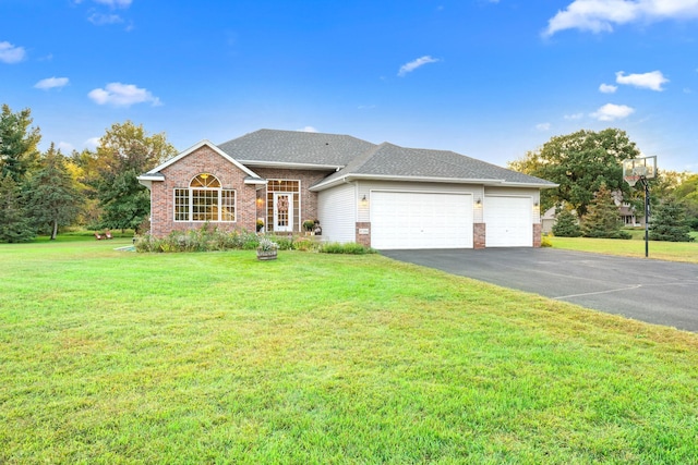 view of front of home featuring a garage and a front lawn