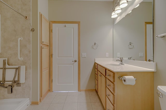 bathroom with tile patterned floors, toilet, and vanity