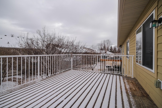 view of snow covered deck