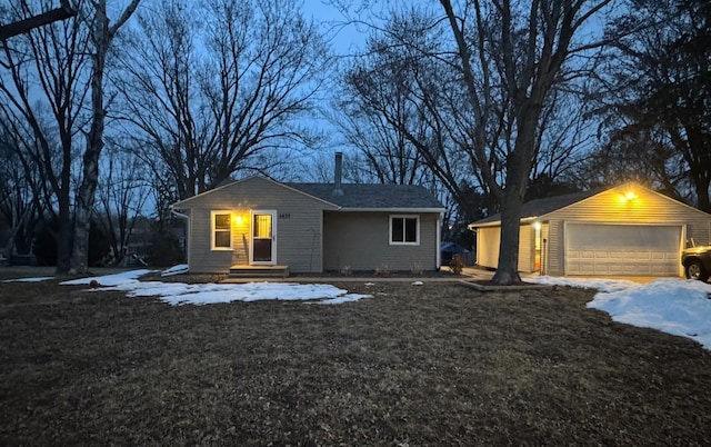 single story home featuring an outbuilding