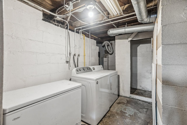 clothes washing area featuring laundry area and washer and dryer