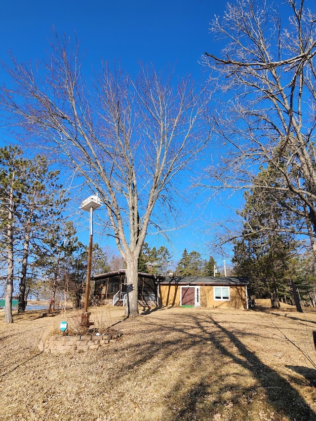 view of front of home with a chimney and a carport