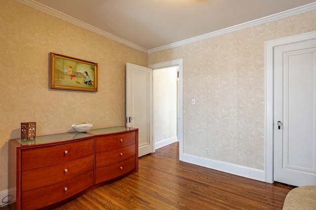 bedroom with hardwood / wood-style flooring and crown molding