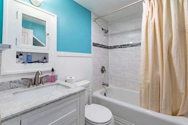 full bathroom with shower / bath combo, vanity, and toilet