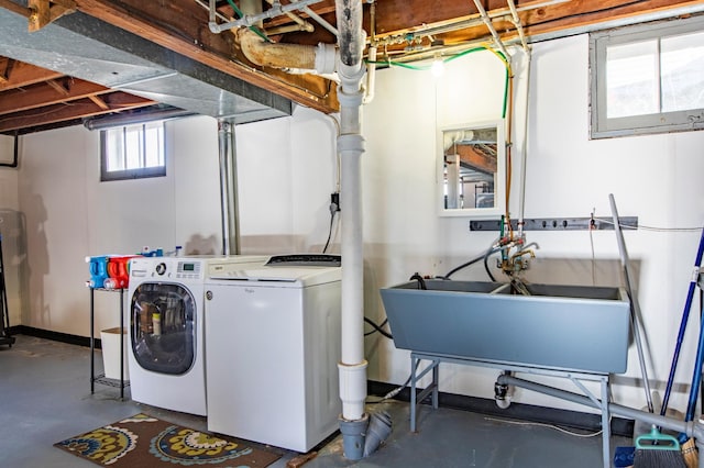 laundry area featuring separate washer and dryer and sink