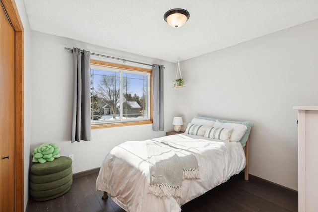 bedroom featuring dark hardwood / wood-style flooring