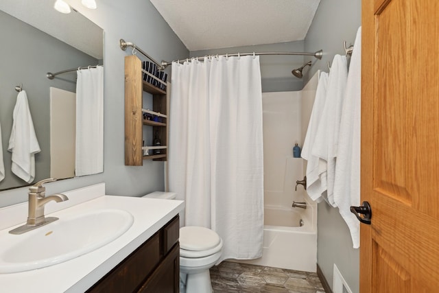 full bathroom with toilet, shower / bath combo with shower curtain, vanity, and a textured ceiling