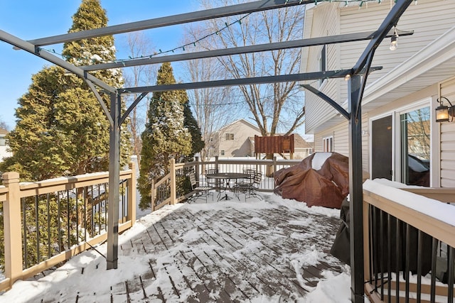 yard covered in snow with a wooden deck