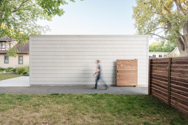 view of side of property with a yard