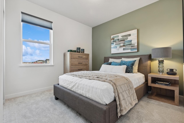 bedroom with light colored carpet