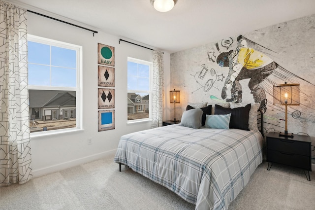 carpeted bedroom featuring baseboards