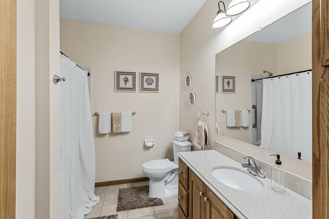 bathroom featuring vanity, tile patterned floors, and toilet