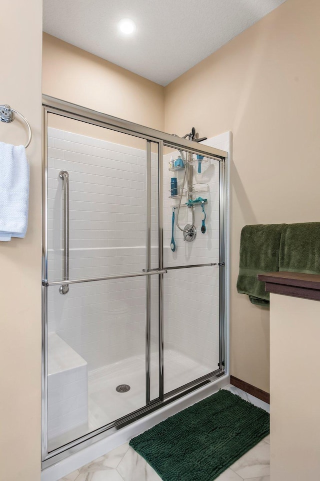 bathroom with an enclosed shower