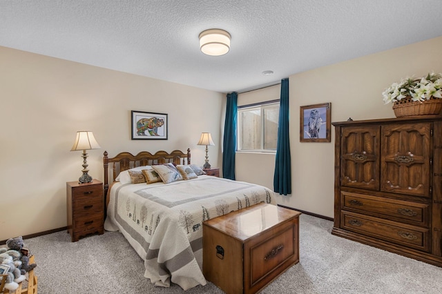 carpeted bedroom with a textured ceiling