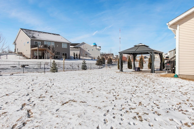 yard layered in snow featuring a gazebo